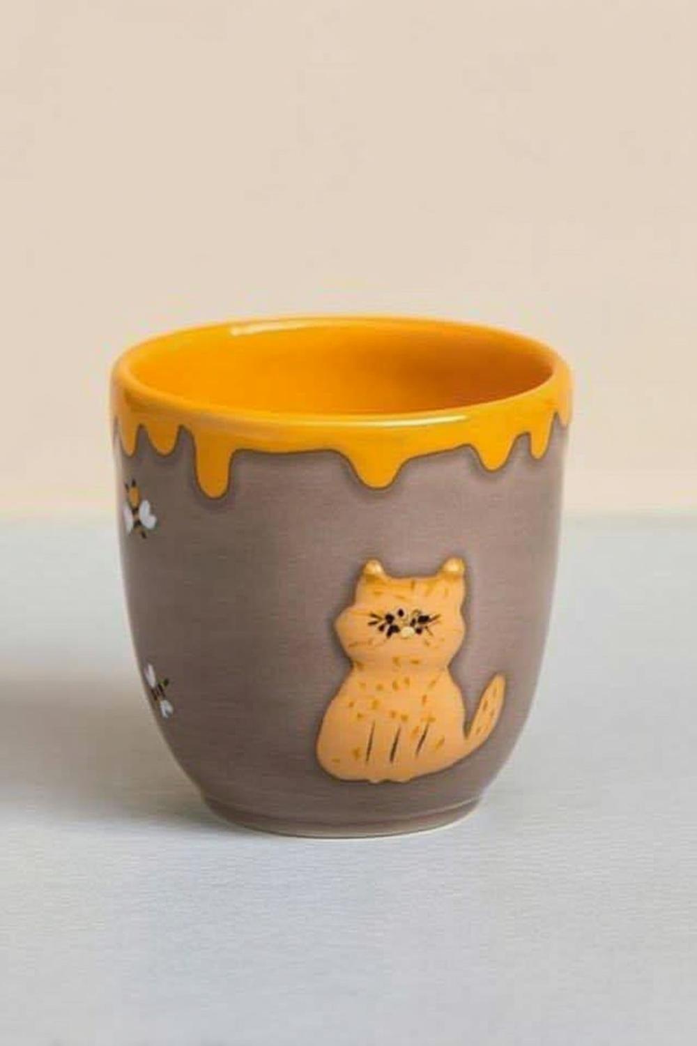 Honigkatze im Topf